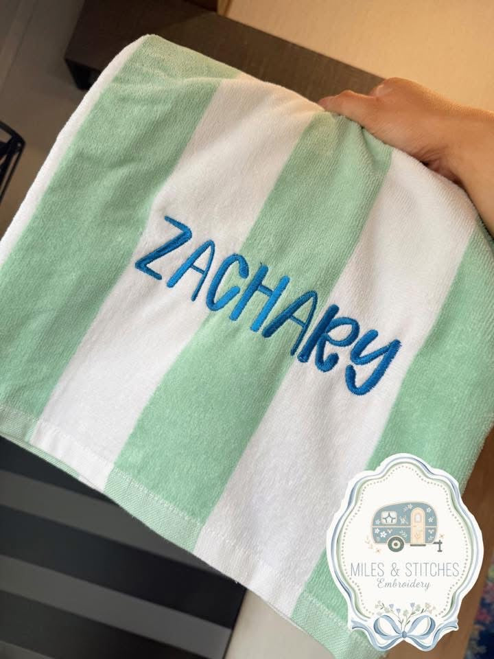 Embroidered striped beach towel